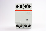 Electromagnetic contactor for controlling electrical loads on a white background close-up