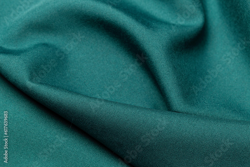 Green color fabric cloth polyester texture and textile background.