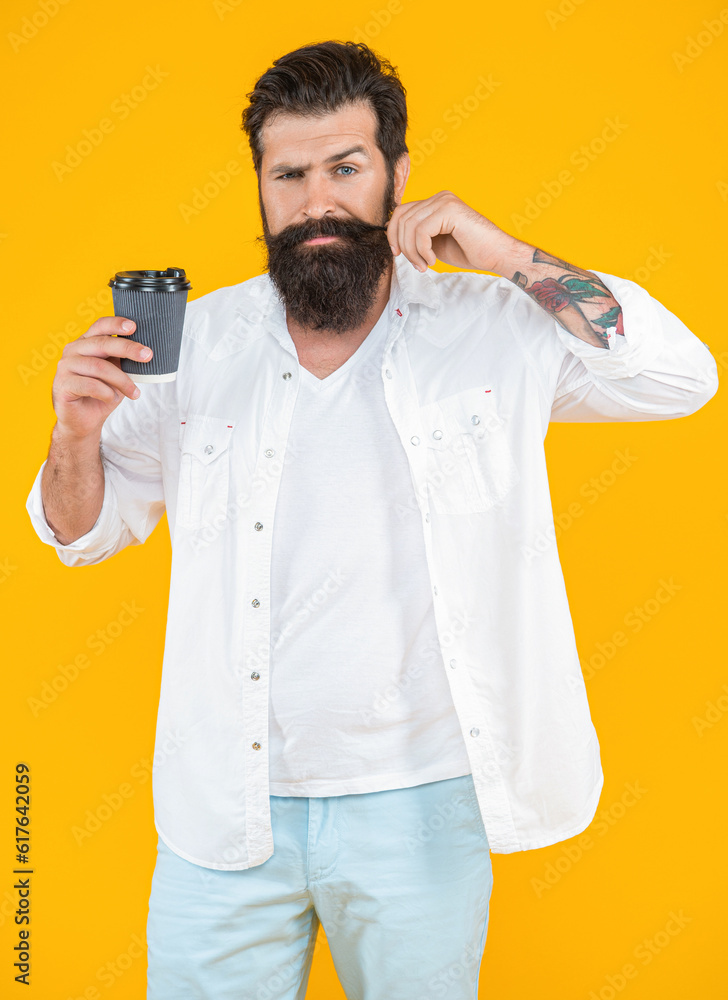 image of barista man with coffee isolated on yellow background image of barista man with coffee isolated on yellow background