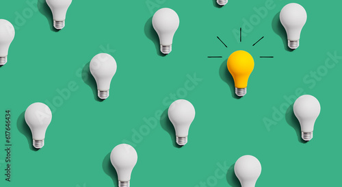 Bild auf Leinwand One out unique idea light bulb concept - Flat lay