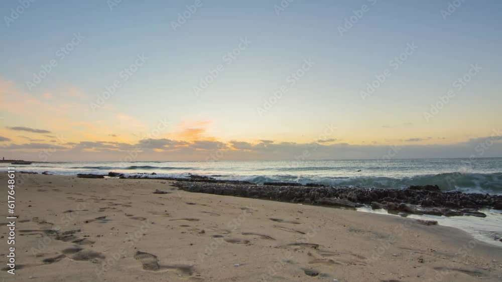 timelapse with lot of hermit crabs in the sand at the beach during warm amazing sunrise timelapse with lot of hermit crabs in the sand at the beach during warm amazing sunrise