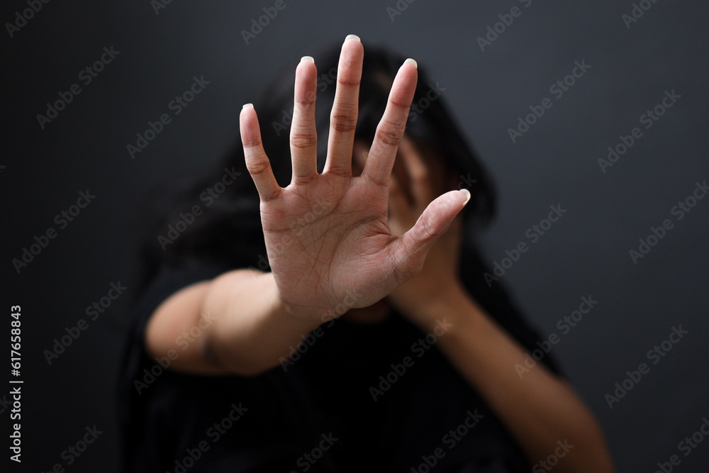Fototapeta premium International Human Right day Concept. Women with her hand extended signaling to stop useful to campaign against violence, gender or sexual discrimination