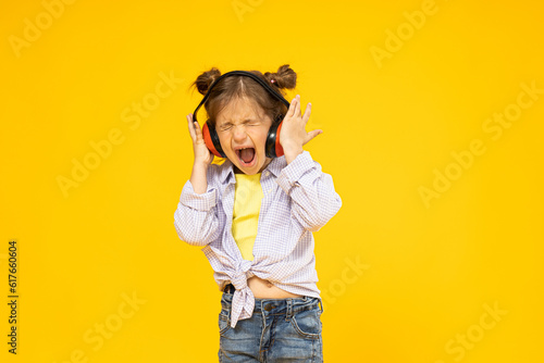 A girl in headphones for noise isolation
