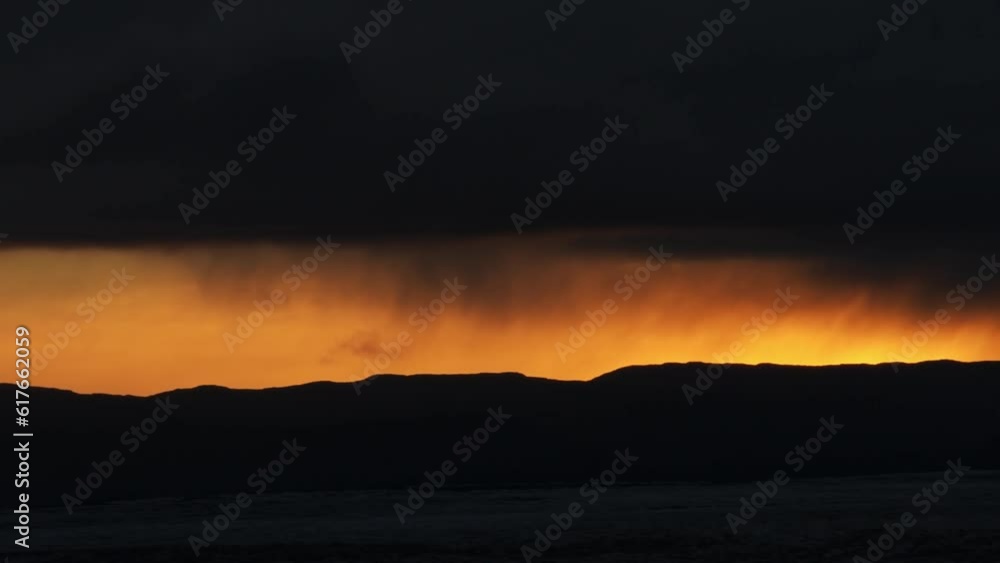 Weather mood at sunset, black clouds, thin veils of rain, Iceland, Europe Weather mood at sunset, black clouds, thin veils of rain, Iceland, Europe