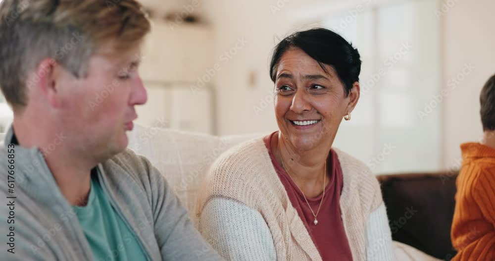 Family, weekend and a grandson talking to his grandmother in the living room of her home for bonding. Love, speaking or conversation with a young man and his senior woman grandparent on the sofa Family, weekend and a grandson talking to his grandmother in the living room of her home for bonding. Love, speaking or conversation with a young man and his senior woman grandparent on the sofa