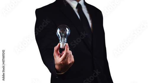 Businessman holding light bulb with clipping path isolated on white background.
