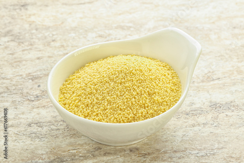 Raw couscous in the bowl