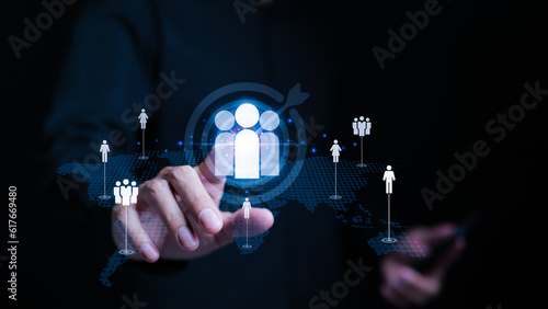 Fototapeta Naklejka Na Ścianę i Meble -  Customer Relationship Management (CRM). Businessman touching human icon with aim target. global structure customer network technology. Customer service, Social media, Digital marketing online,