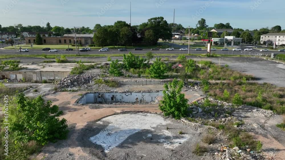Destroyed retail land in America. Old foundation of restaurant torn up after demolition. Aerial establishing shot. Destroyed retail land in America. Old foundation of restaurant torn up after demolition. Aerial establishing shot.