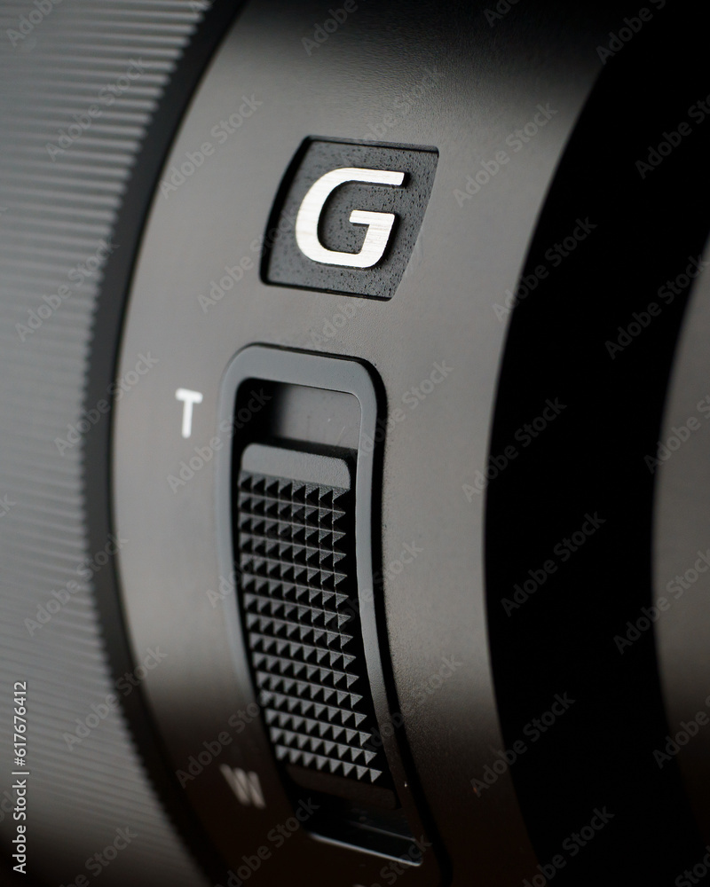 Vertical close-up shot of camera zoom controllers. Vertical close-up shot of camera zoom controllers.
