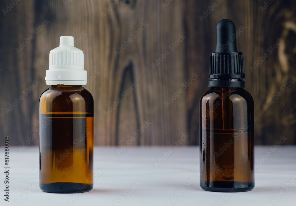 Closeup of CBD oils in brown glass bottles