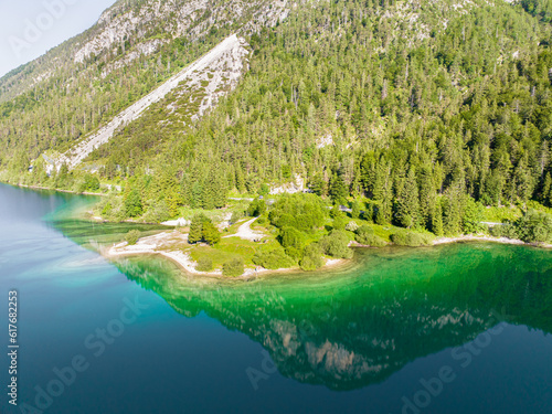 Lago del Predil, Predil lake in the Morning Calm with Mirrored surface, Tarvisio Italy