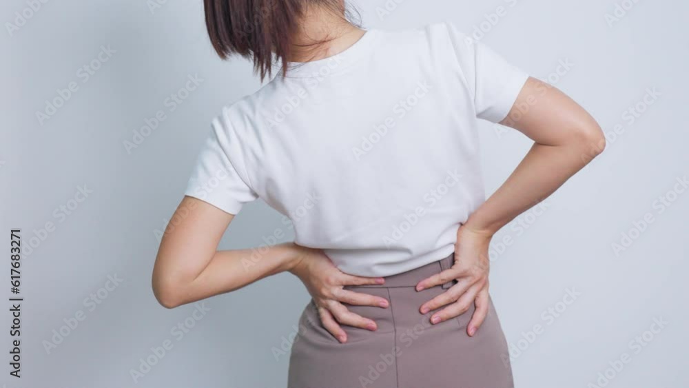 adult female with muscle pain on gray background. Elderly woman having back body ache due to Piriformis Syndrome, Low Back Pain and Spinal Compression. Office syndrome and medical concept adult female with muscle pain on gray background. Elderly woman having back body ache due to Piriformis Syndrome, Low Back Pain and Spinal Compression. Office syndrome and medical concept