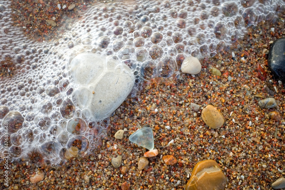 Small round stones background. Stone texture. Rough surface of small pebble stone. Small round stones background. Stone texture. Rough surface of small pebble stone.