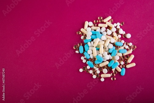 Wallpaper Mural Closeup of medical pills and capsules isolated on a pink background Torontodigital.ca