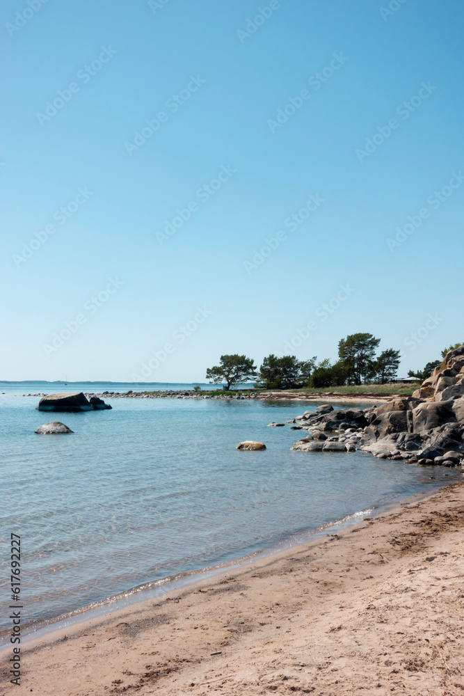Trouville beach in Sandhamn in Stockholm archipelago with calm turquoise water and beautiful coastal nature scene  
