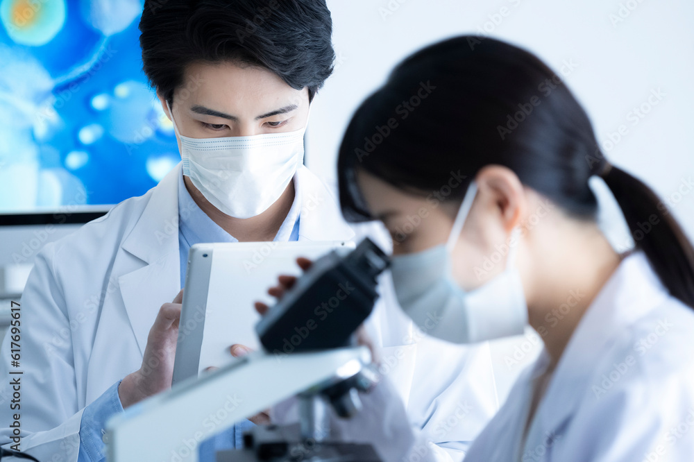 A male scientist conducting research with digital tablet A male scientist conducting research with digital tablet