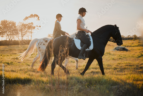 Horse riding, countryside and hobby with friends in nature on horseback through a field during a summer morning. Freedom, equestrian and female riders outdoor together for travel, fun or adventure