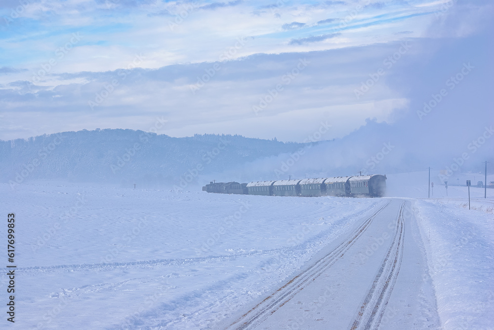 Steam Train in a Snowy Winter Landscape