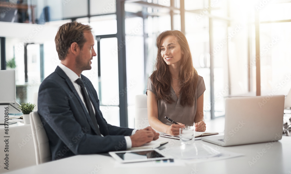 Laptop, teamwork or training with a mentor and employee in the boardroom for an introduction to the business. Collaboration, coaching or partnership with a male manager talking to a woman colleague Laptop, teamwork or training with a mentor and employee in the boardroom for an introduction to the business. Collaboration, coaching or partnership with a male manager talking to a woman colleague