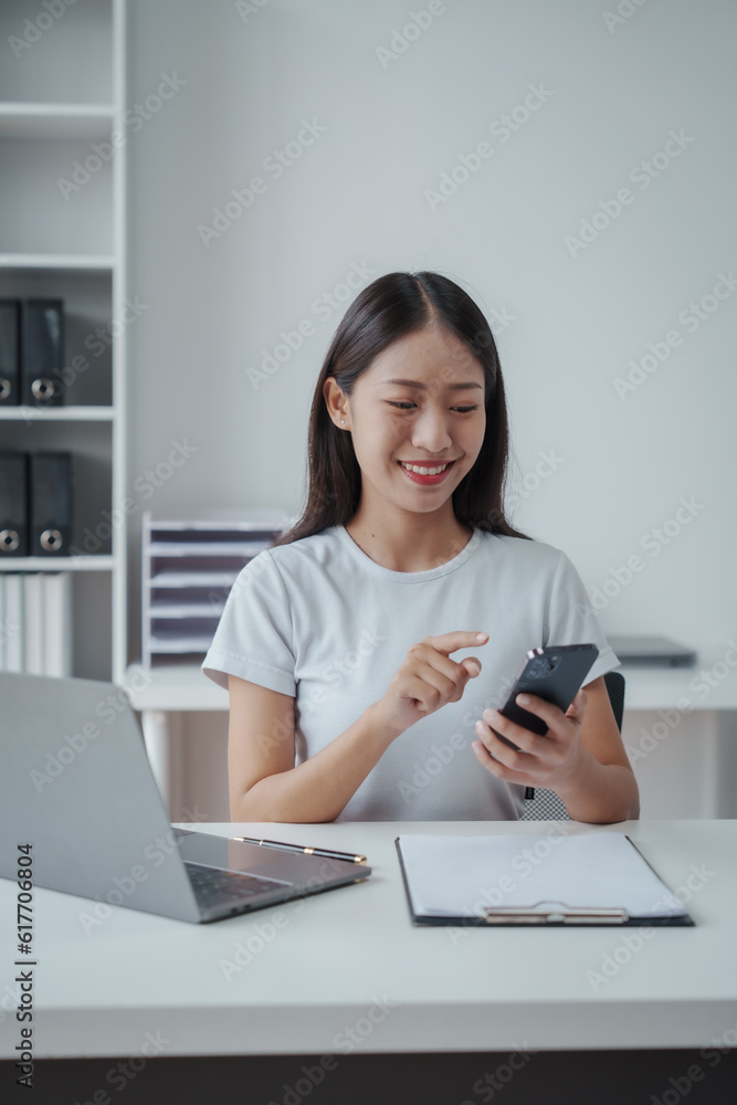 Young Asian woman university student satisfied with learning english language during online courses via laptop computer, learning online with webinar, video tutorial, internet lessons Young Asian woman university student satisfied with learning english language during online courses via laptop computer, learning online with webinar, video tutorial, internet lessons