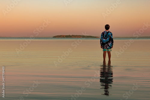 person on the beach at sunset, Coffin Bay, Australia 