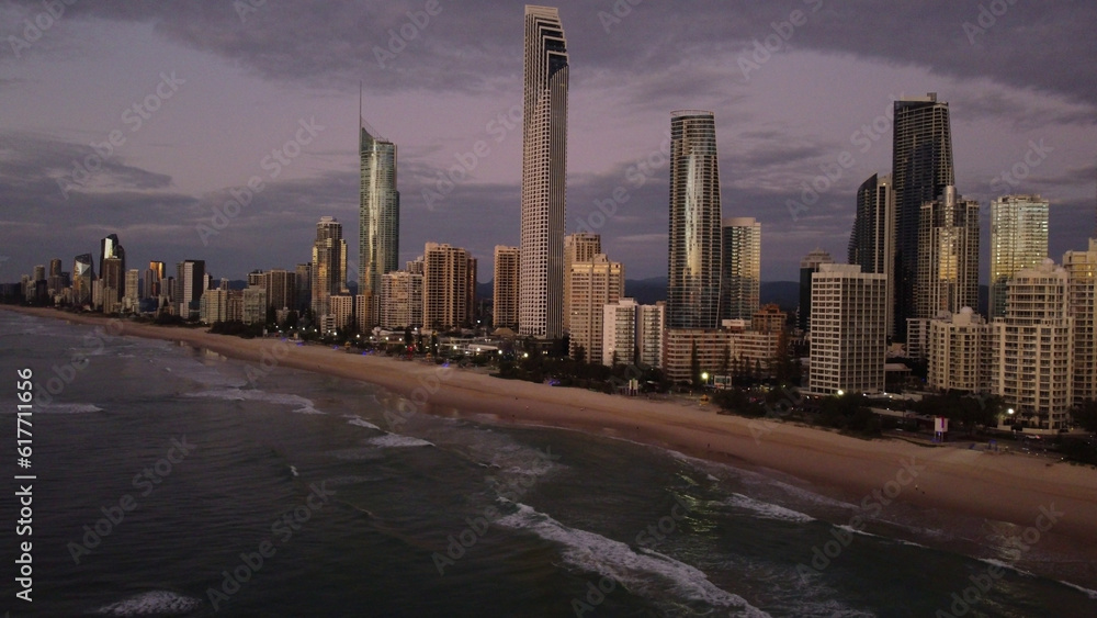 Obraz premium Aerial view of a bustling cityscape with skyscrapers at the shore