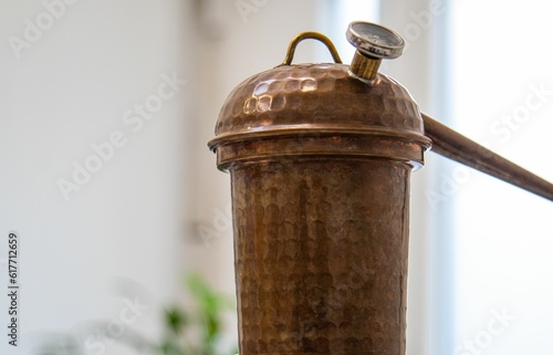 there is a small old copper pipe on the table at the kitchen