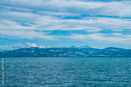 Germany  bodensee lake constance beautiful panorama view on sunny day into swiss alps mountains saentis and nature landscape