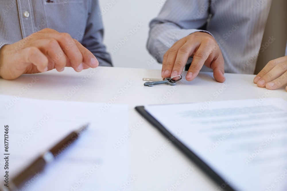 Sales manager giving advice application form document, considering mortgage loan offer for car and house insurance. Sales manager giving advice application form document, considering mortgage loan offer for car and house insurance.