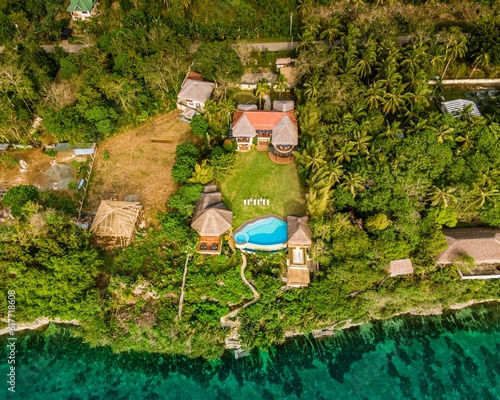 an aerial view of a home surrounded by green plants and trees photo