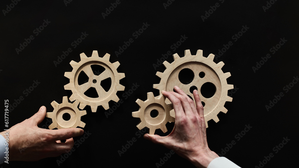 Wooden mechanisms on a black background. Black chalk board. Wooden mechanisms on a black background. Black chalk board.
