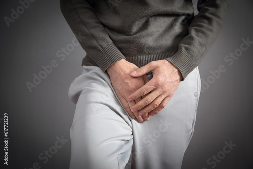Fotografi Hand holding crotch. Urinary Tract Infection. Cystitis