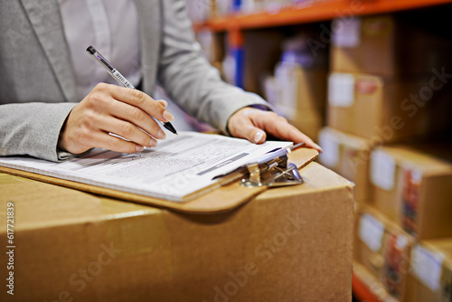 Hands, sign and clipboard with paperwork in warehouse, logistics and export with supply chain factory. Delivery, ecommerce and person sign distribution paperwork, shipping and wholesale and invoice © Arcurs Corp/peopleimages.com