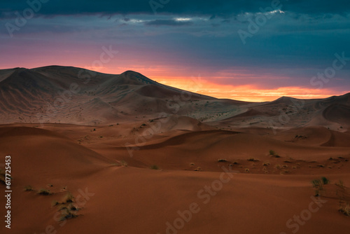 Sunset in Merzouga in the Sahara Desert  Morocco. Merzouga is a small village in southeastern Morocco  about 35km  22 miles  southeast of Rissani  about 55km  34 miles  from Erfoud and about 50km  31 