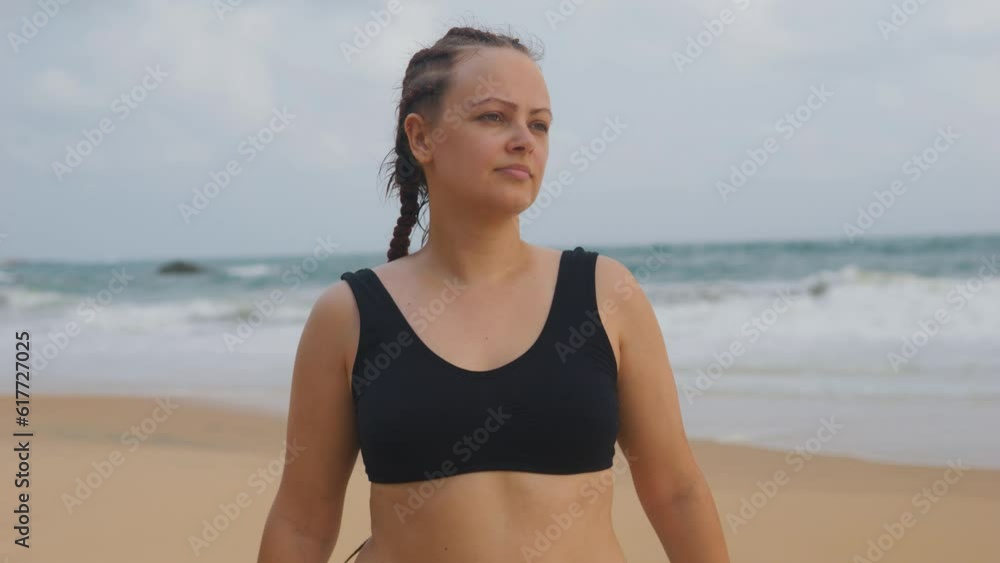 Female boxer MMA fighter girl doing stretching on beach at sunset sunrise. Female boxer MMA fighter girl doing stretching on beach at sunset sunrise.