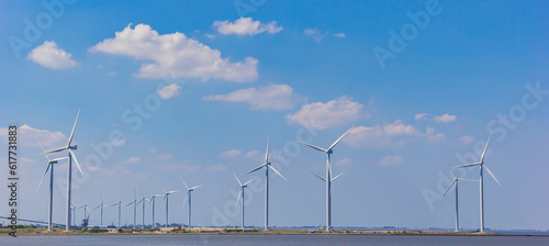 Wind turbines at the coast in Termunterzijl, Netherlands photo