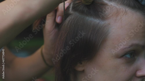 Process of weaving making boxer braids cornrows by a hair braider. photo