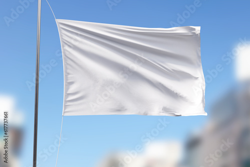 white flag against blue sky and clouds, mockup