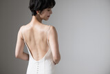 Asian women's beautiful backs and shoulder blades. Figure of a looking back beauty looking back. Copy space available on the right.