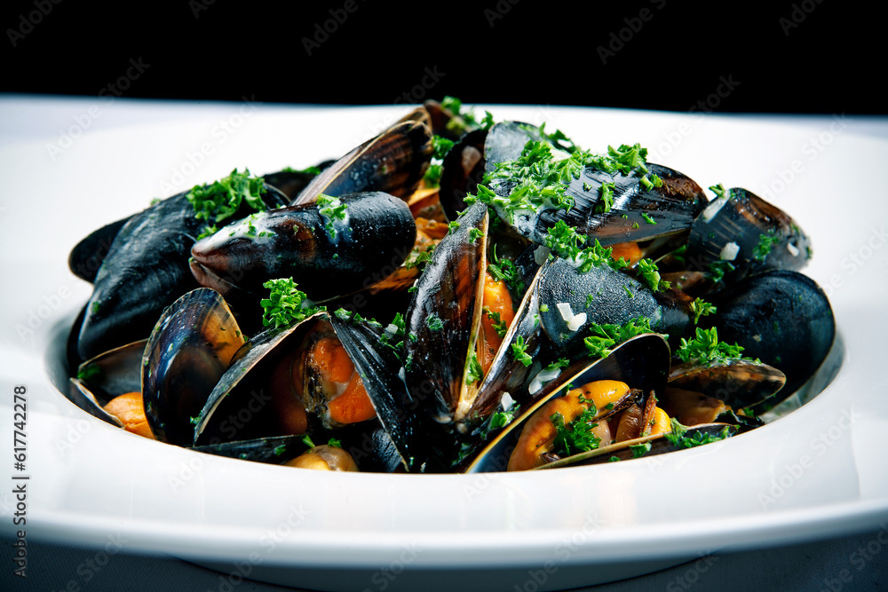 Stemed mussels on a plate at restaurant Stemed mussels on a plate at restaurant