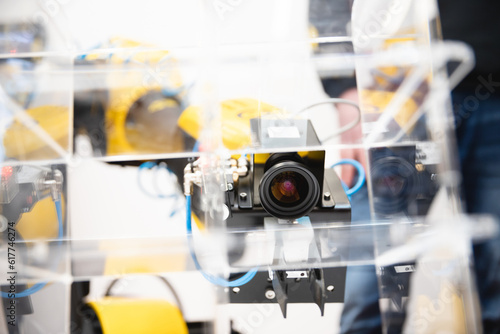 Machine vision. The manipulator arm uses a camera to observe and control objects in stock.