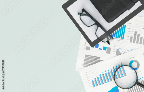Business graphs, charts, magnifying glass and calculator on table. Financial development, Banking Account, Statistics