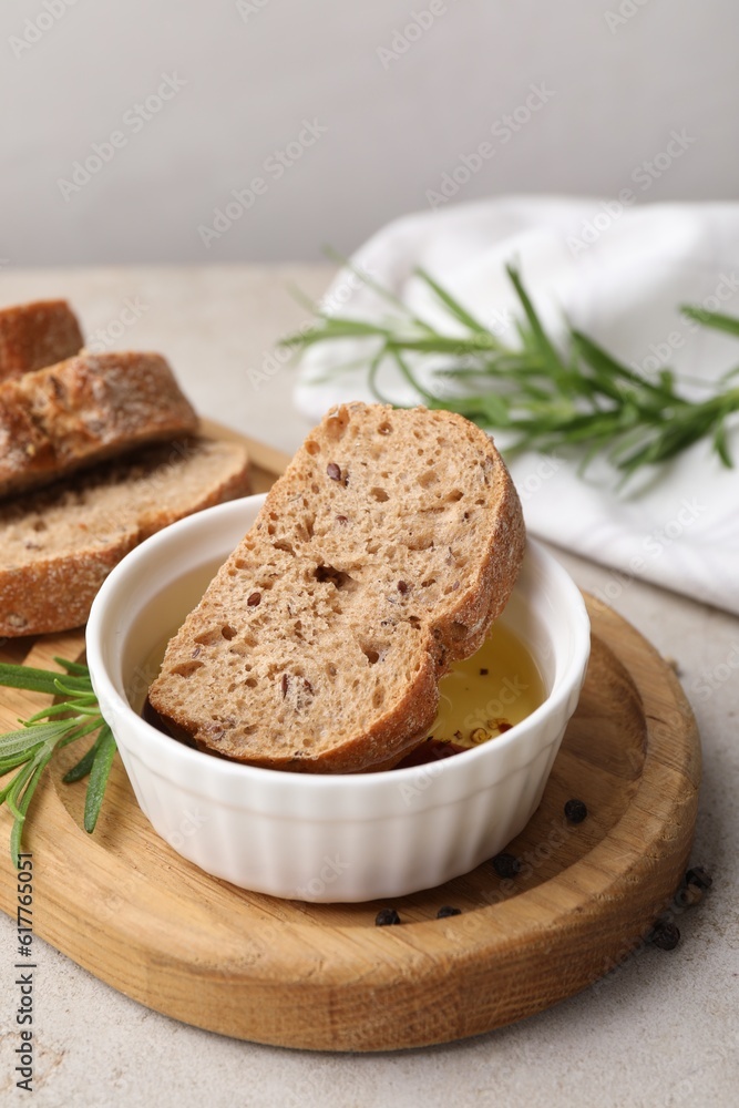 Bowl of organic balsamic vinegar with oil served with spices and bread slices on beige table Bowl of organic balsamic vinegar with oil served with spices and bread slices on beige table