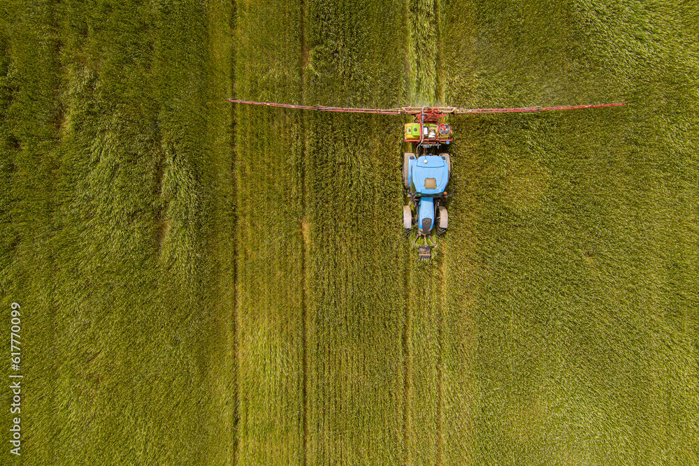 Tractor spraying agricultural fields Tractor spraying agricultural fields