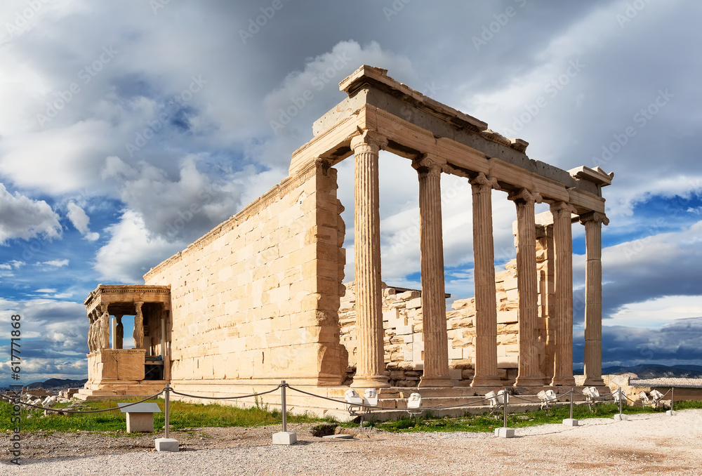 Ancient Erechtheion Greek temple on sunset with Porch of the Caryatids at Acropolis in Athens, Greece.