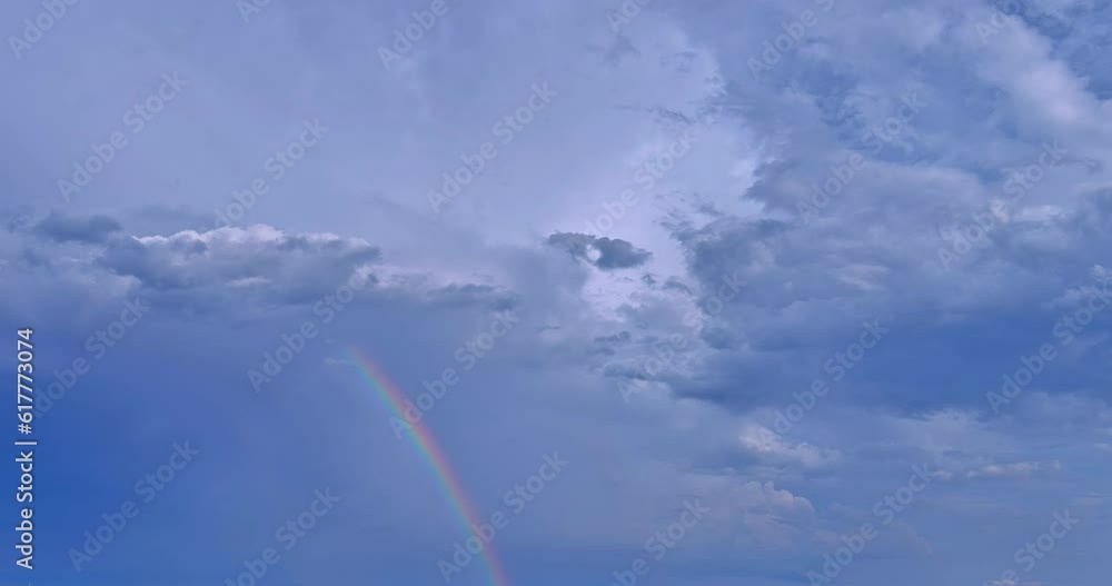 Rainbow became visible in sky once strong thunderstorm had subsided. Rainbow became visible in sky once strong thunderstorm had subsided.