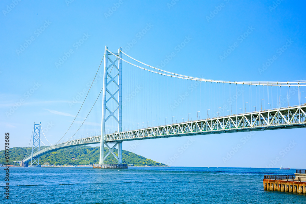 舞子公園から見た初夏の明石海峡大橋 兵庫県神戸市 Akashi Kaikyo Bridge in early summer seen from Maiko Park. Hyogo Pref, Kobe City. 舞子公園から見た初夏の明石海峡大橋 兵庫県神戸市 Akashi Kaikyo Bridge in early summer seen from Maiko Park. Hyogo Pref, Kobe City.