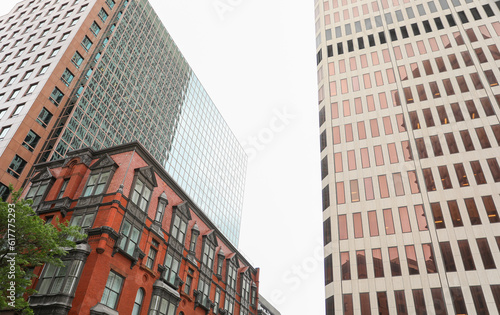 modern building in the heart of the financial district, symbolizing progress and prosperity in the commercial real estate industry. Its large windows represent transparency and sleek design