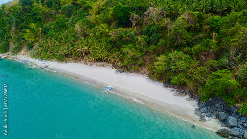 Beach and sea. Aerial view of the coast of a tropical island and a sandy beach among the jungle.